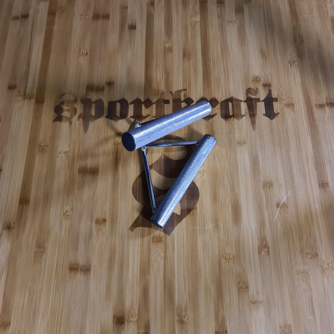 Taivutettu kolmiokahva