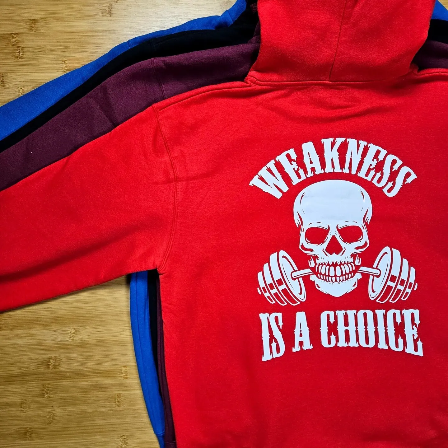 WEAKNESS IS A CHOICE, huppari unisex, 4 väriä