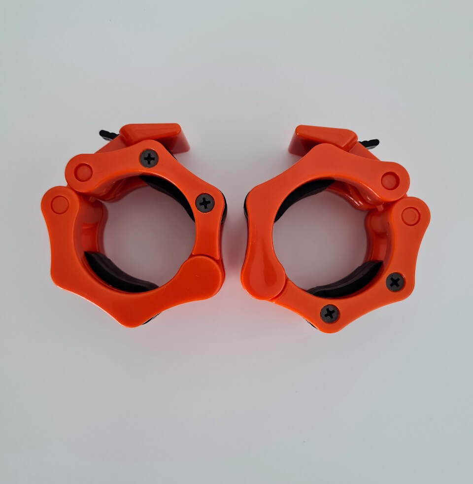 Kirkkaan oranssit SportKraft Lock Jaw levylukot 50 mm tangolle, kestävät ja tyylikkäät.