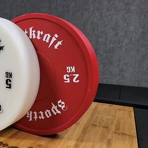Punainen SportKraft 2,5 kg painonnostolevy voimaharjoitteluun, kestävä ja laadukas kuntosalivaruste.