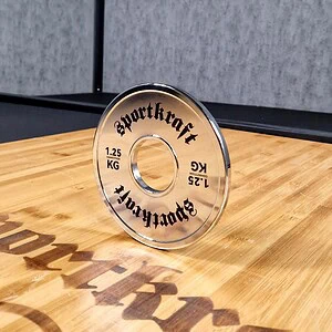 SportKraft kalibroitu teräslevypaino, kromi - 1,25kg